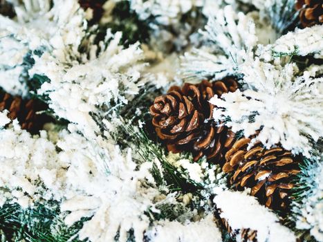 Pine tree decorated with cones for Christmas and New Year celebration. Holiday winter background.