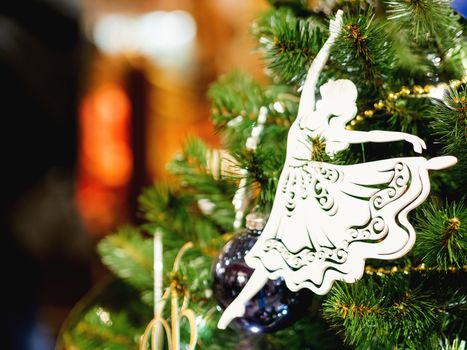 Little graceful ballerina, decorative toy for Christmas tree. Beautiful decoration for New Year celebration.
