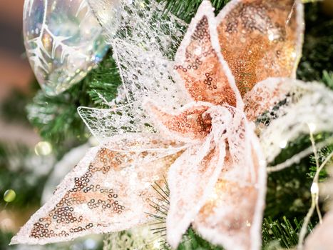 Elegant flower, made of fabric with sequins. New Year decoration for Christmas tree.