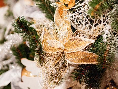 Elegant flower, made of fabric with sequins. New Year decoration for Christmas tree.