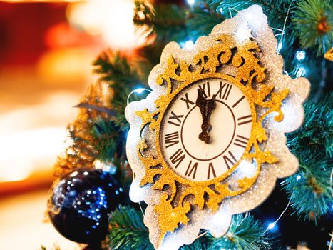 Decorative watch made of spangles. New Year decoration for Christmas tree.