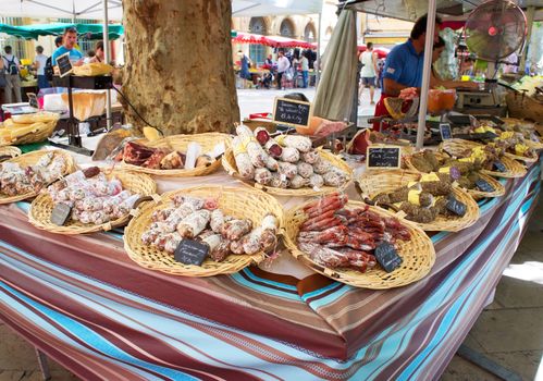 Display of saucissons (dried sausages) at an outdoor market in Aix-en-Provence, France