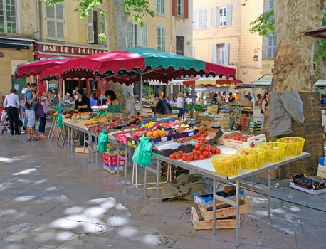 Outdoor market in a small square in Aix-en-Provence, France               