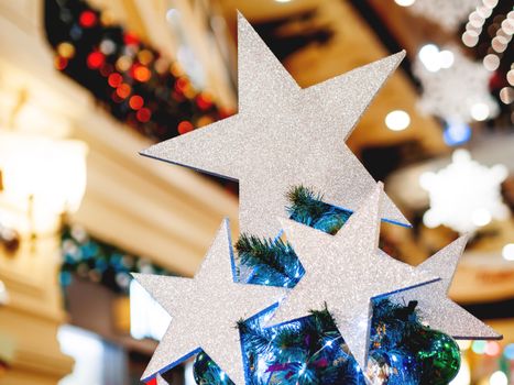 Silver shining stars, made of spangles. New Year decoration for Christmas tree top.