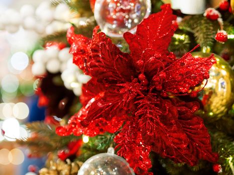 Elegant flower, made of fabric with sequins. New Year decoration for Christmas tree.
