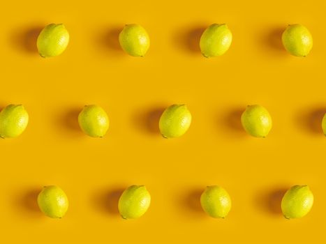 Citrus backdrop. Juicy ripe lemon  pattern on yellow background top.