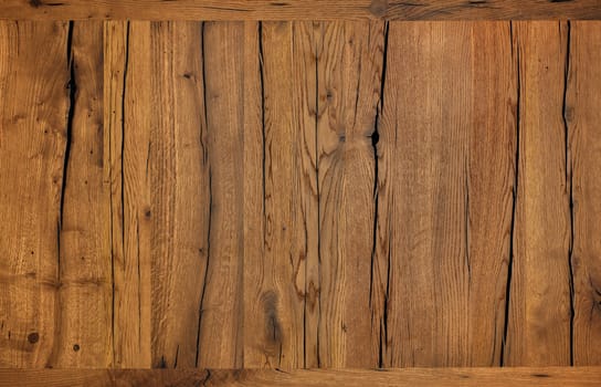 Old, cracked brown wooden background and texture treated with modern protective reagents and wax, high resolution.