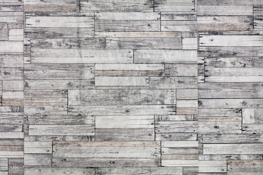 Mosaic of old wooden slats, wooden boards. Gray slats, board, breed. Vintage rustic close-up wood texture.
