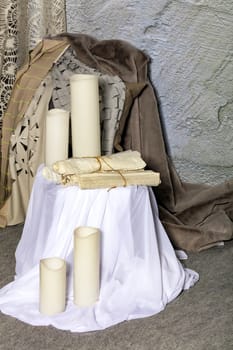 Various contemporary fabrics in white, beige and light colors and elegant ivory vases.