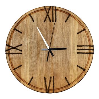 Beautiful wooden wall clock made of light oak wood and roman numerals on the dial made of natural twine on white background isolated.
