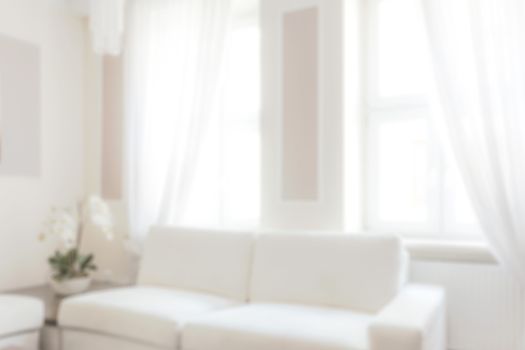 Blurred view of a white and bright luxury apartment or livingroom interior.