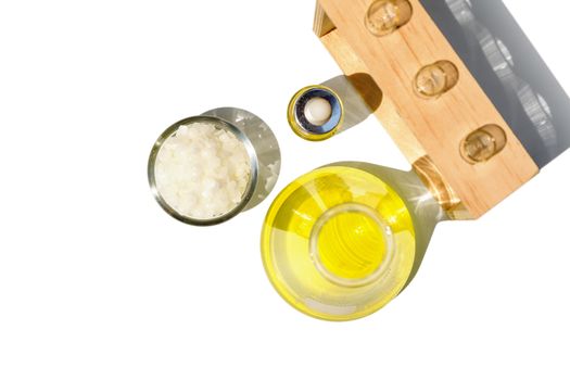 Yellow cosmetic color (oil), Polyacrylic acid, Microcrystalline wax. Chemicals for beauty care on laboratory table. (Top View)