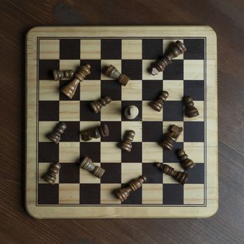 a chessboard with the king and some inverted opposing pieces