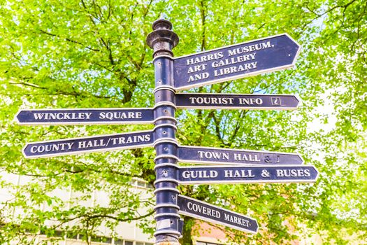 Town signpost showing directions to various places in the center of historical Preston