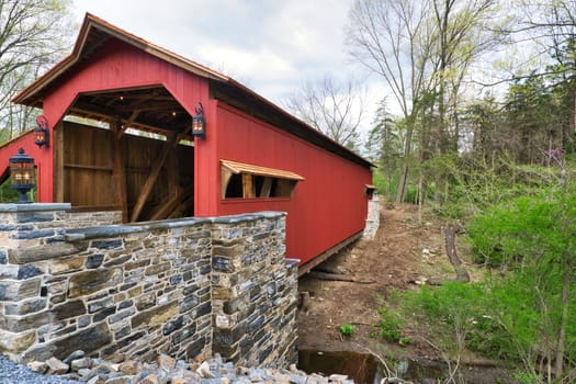 Restored Burr Arch Covered Bridge as Seen on a Spring Day