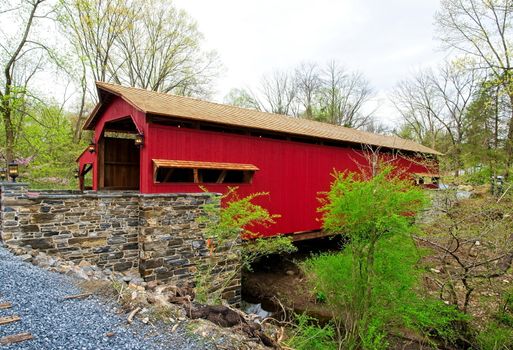 Restored Burr Arch Covered Bridge as Seen on a Spring Day