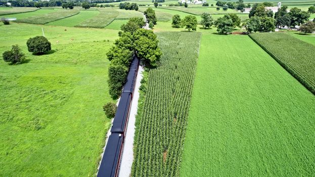 Aerial View of Amish Farmlands by Rail Road Tracks