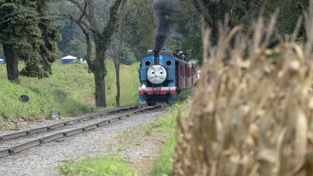 Strasburg, Pennsylvania - September 2018: Thomas the Train in Amish Countryside Puffing Away