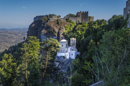 Above the old castle as close-up the tower pepoli and in the distance the plains of the island of Sicily from the ancient city of Erice