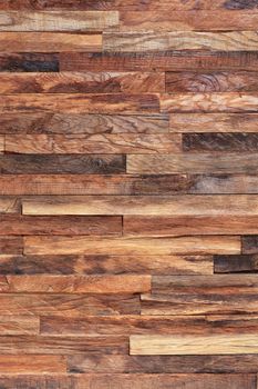 Vertical mosaic, texture and background of old wooden slats, wooden planks. Brown slats, planch, bred wall. Vintage rustic close-up wood texture.