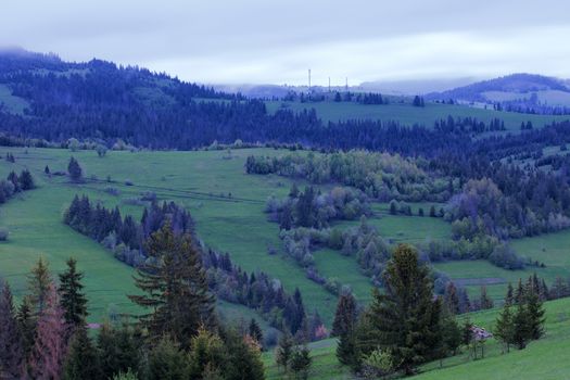 Early morning in the mountains of the Carpathians. Mountain landscape. View from the mountainside.