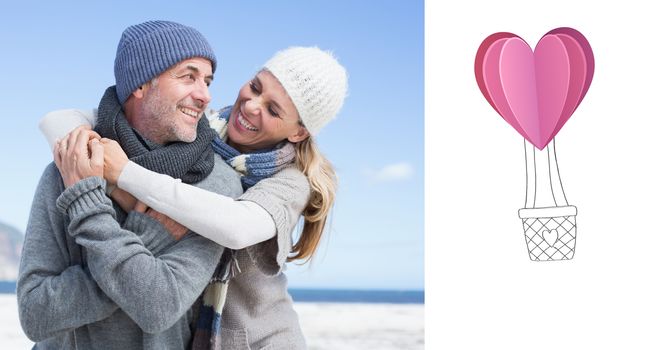 Attractive couple hugging on the beach in warm clothing against heart hot air balloon