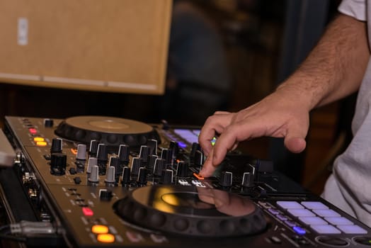 Disc Jockey playing music. Running the mixer table. business party