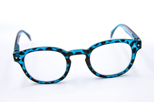 Blue-black eyeglasses strap on the white ground.