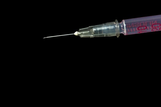 Sharp needle of syringe, Insulin injection on black background
