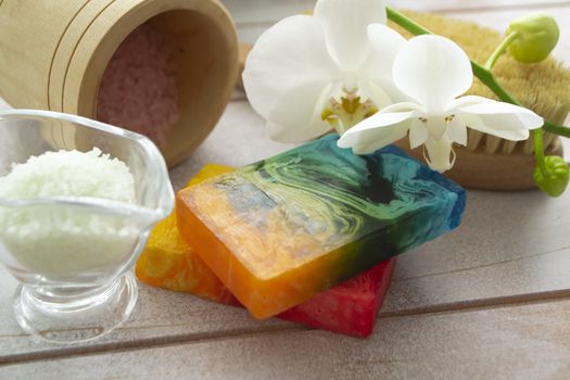 Dead sea salt and homemade soap, wellness and relaxation. Orchid flower