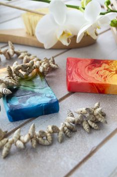 colorful handmade soap on wooden table, spa set
