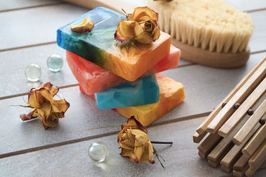 Organic handmade soap. Colorful soap with dry rose flower