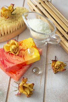 spa treatment set with sea salt, dry rose flowers and aroma organic soap