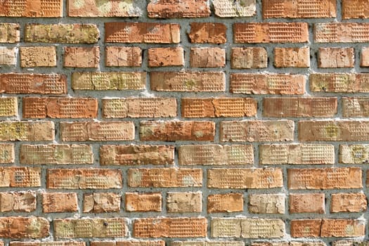 The old brick walls have an orange color and a weathered texture