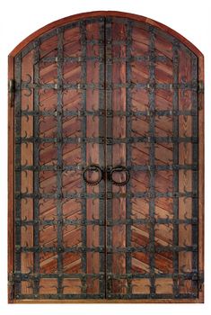 Antique wooden antique wooden doors with a forged iron grille and cross bars isolated on a white background.