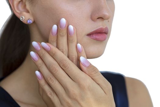 Beautiful woman's nails with beautiful french manicure ombre peach and white