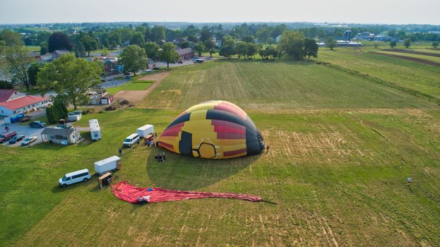 Aerial View of Hot Air Balloons Trying to Launch in a Wind as Seen by a Drone