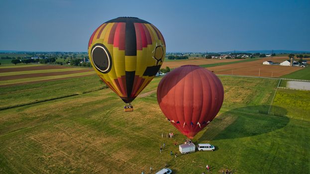 Aerial View of Hot Air Balloons Trying to Launch in a Wind as Seen by a Drone
