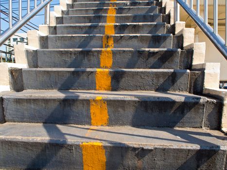 Yellow line on Concrete Stair of Overpass