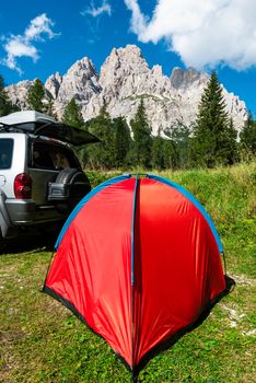 Tent in Mountains. Road trip and Outdoor Adventure Activity.