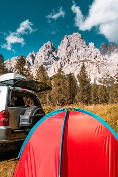 Tent in Mountains. Road trip and Outdoor Adventure Activity.