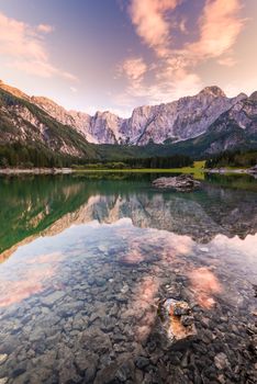 Mountains Reflection in Clear Fusine Lake Water at Beautiful Sunset.