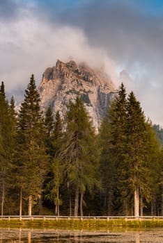 Dramatic Sunset over Italian Dolomites Peaks. Tre Cime di Lavaredo at Lake Antorno. Fall Season.