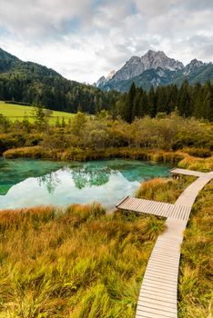 Emerald Lake at Zelenci in Slovenia. Alpine Landscape at Autumn Season.