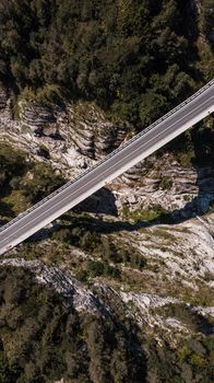 Road Bridge Over Valley, Mangart, Slovenia. Aerial Top Down Drone View.
