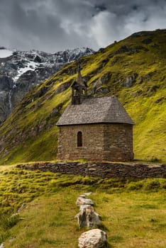 Moody Autumnal Image of Pasterzenhaus Chapel in Austria Alps.