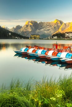 Vibrant Boats at Lake Misurina at Beautiful Sunrise in Dolomites, Italy