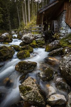 Creek Flowing by Ancient Wooden Mill near Gollinger Waterfall.