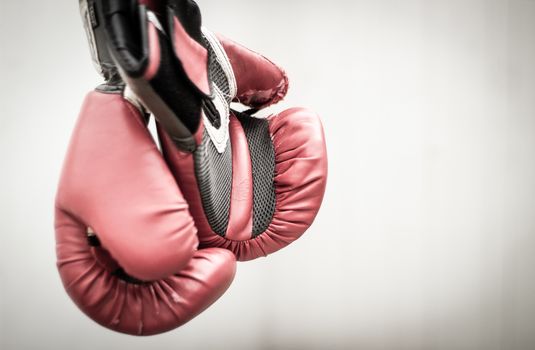 Photograph of a pair of red boxing gloves