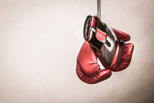 Photograph of a pair of red boxing gloves